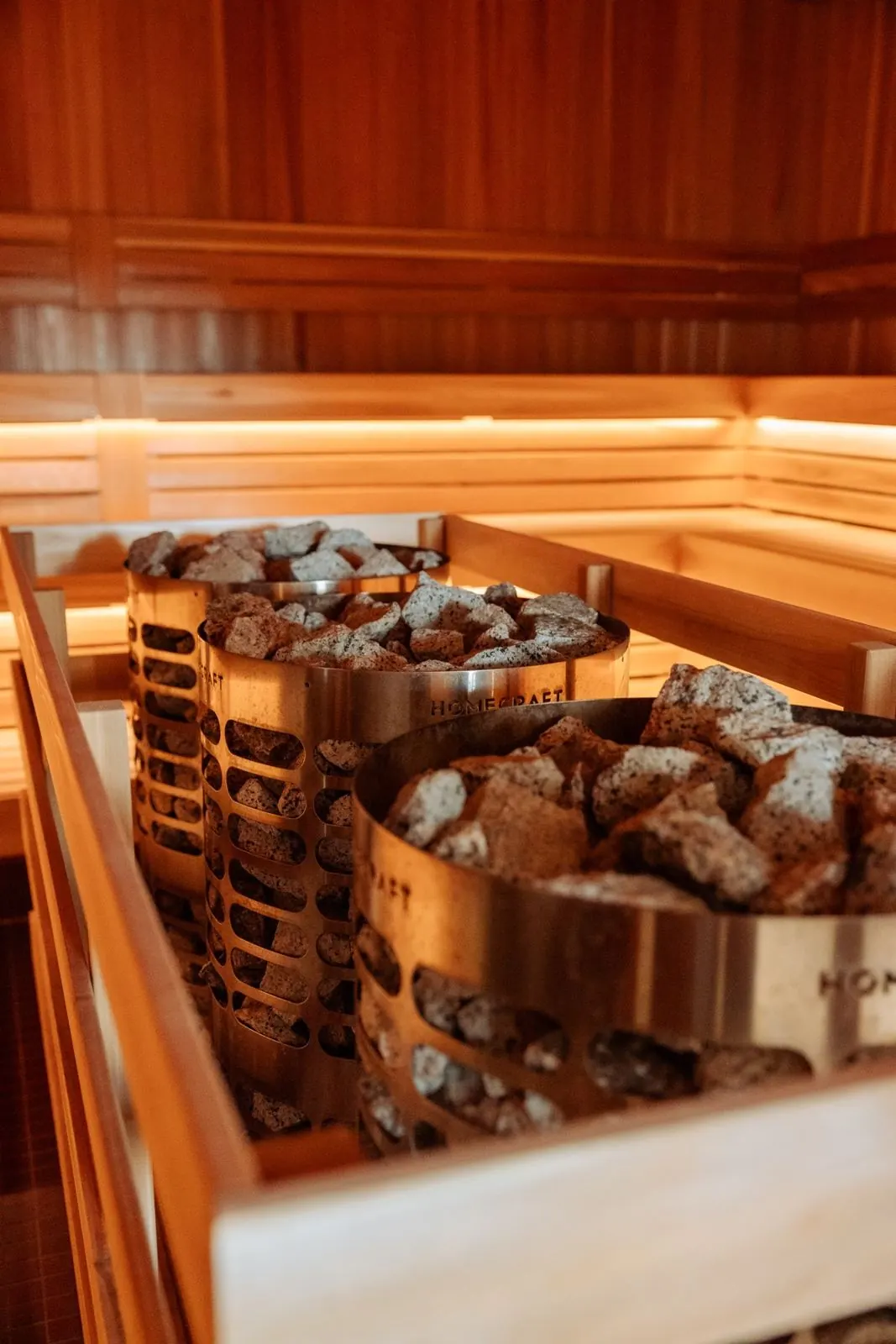 Sauna stones on the heater inside the cedar sauna